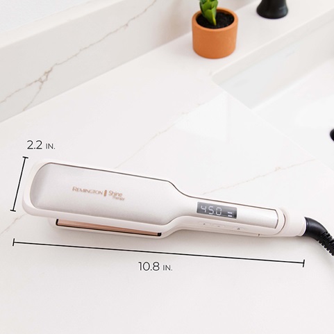 Flat iron is 10.8 inches long by 2.2 inches wide.