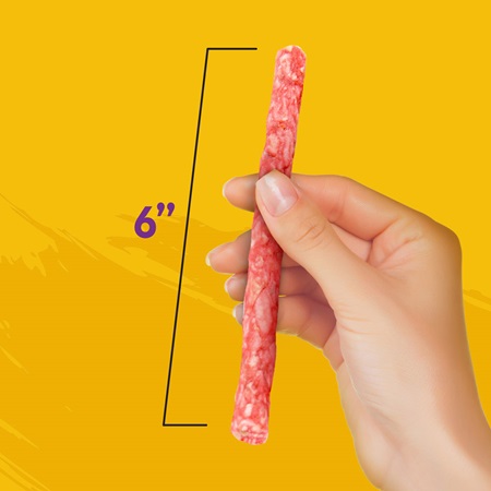 Image of woman holding 6 inch treat