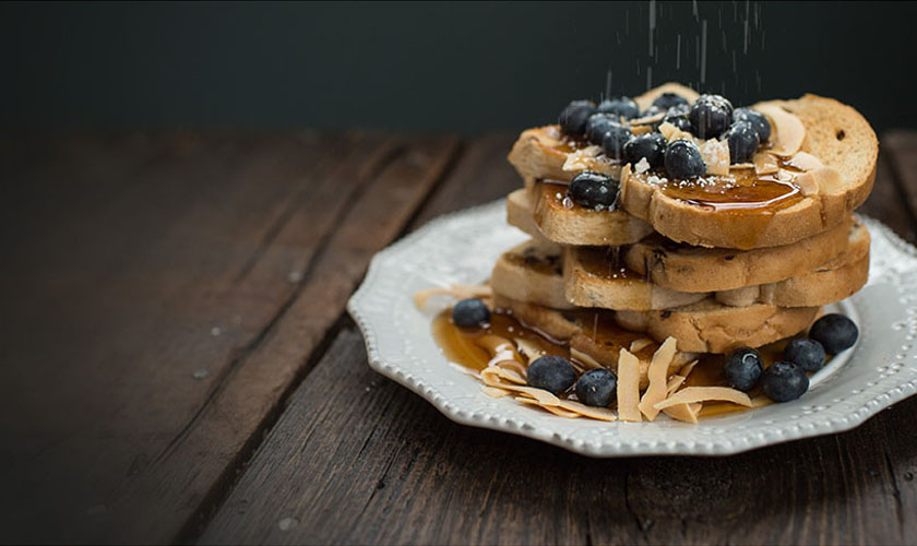 Plate with a stack of pancakes and blueberry