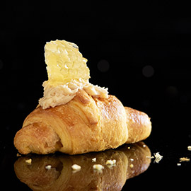 Sweet spread on croissants with honeycomb